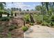 Beautiful ranch-style home with lush landscaping, stone stairs and hardscaped driveway providing elegant curb appeal at 511 Pine Valley Se Rd, Marietta, GA 30067