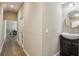 Hallway shows hardwood floors and access to a living space and bathroom at 511 Pine Valley Se Rd, Marietta, GA 30067