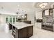 Gourmet kitchen featuring an island, modern appliances, and a view of the living room at 511 Pine Valley Se Rd, Marietta, GA 30067