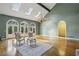 Elegant living room featuring soaring ceilings, skylights, fireplace and hardwood flooring at 511 Pine Valley Se Rd, Marietta, GA 30067