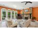 Cozy living area features a fireplace and large windows offering serene views at 511 Pine Valley Se Rd, Marietta, GA 30067