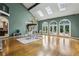 Bright living area featuring hardwood floors, chandelier, skylights, and French doors leading to the outdoors at 511 Pine Valley Se Rd, Marietta, GA 30067