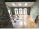 Bright living room with hardwood floors, skylights, fireplace, and three sets of arched doors at 511 Pine Valley Se Rd, Marietta, GA 30067