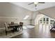 Living room features a dining table, skylight, ceiling fan, and hardwood floors at 511 Pine Valley Se Rd, Marietta, GA 30067