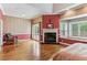 Elegant main bedroom with fireplace, hardwood floors, bay window, and access to the outdoors at 511 Pine Valley Se Rd, Marietta, GA 30067