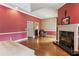 Cozy main bedroom with fireplace, hardwood floors, and decorative molding at 511 Pine Valley Se Rd, Marietta, GA 30067