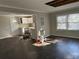 Open-concept living space with modern flooring, stainless steel appliances, and an abundance of natural light at 915 Lake Dr, Snellville, GA 30039