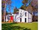 Modern home with a bright red door and nicely manicured lawn at 2645 Shadow Woods Circle Ne, Marietta, GA 30062