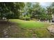 Expansive backyard with manicured lawn, mature trees, and potential for outdoor activities and relaxation at 285 Aspen Way, Fayetteville, GA 30214