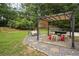Charming backyard patio with pergola, swing, and outdoor seating, ideal for entertaining and relaxation at 285 Aspen Way, Fayetteville, GA 30214