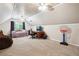 Bright bedroom with vaulted ceilings, large window, ceiling fans, and space for a seating area and study space at 285 Aspen Way, Fayetteville, GA 30214