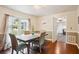 Dining room features hardwood floors, a wooden table, views of the backyard, and neutral decor at 285 Aspen Way, Fayetteville, GA 30214