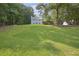 Charming two-story home with a neatly maintained lawn and mature trees at 285 Aspen Way, Fayetteville, GA 30214