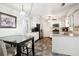 Bright kitchen featuring white cabinets, granite countertops, stainless steel appliances, and a cozy breakfast nook at 285 Aspen Way, Fayetteville, GA 30214