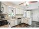Bright kitchen with granite countertops, stainless steel appliances, and stylish slate tile floors at 285 Aspen Way, Fayetteville, GA 30214