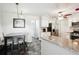 Eat-in kitchen offers a center island, stainless appliances, and white cabinetry at 285 Aspen Way, Fayetteville, GA 30214