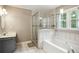 Main bathroom features a soaking tub, separate shower, and sleek vanity at 285 Aspen Way, Fayetteville, GA 30214