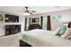 Cozy main bedroom with plush carpeting, ceiling fan, and fireplace at 285 Aspen Way, Fayetteville, GA 30214