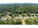 Picturesque aerial view of new construction homes surrounded by lush greenery and scenic surroundings at 2855 Pilgrim Mill, Cumming, GA 30041