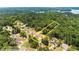 Aerial view highlighting the property lines nestled in a lush, green area near a lake at 2855 Pilgrim Mill, Cumming, GA 30041