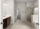 Bright bathroom with double vanity and glass enclosed shower with soaking tub at 2855 Pilgrim Mill, Cumming, GA 30041