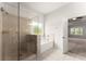 Bright bathroom with glass enclosed shower and soaking tub at 2855 Pilgrim Mill, Cumming, GA 30041
