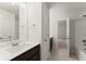 Bright bathroom with large mirror, neutral countertop, and dark wood cabinetry at 2855 Pilgrim Mill, Cumming, GA 30041