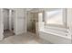 Bright bathroom with glass enclosed shower and soaking tub, and walk-in closet at 2855 Pilgrim Mill, Cumming, GA 30041