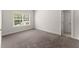 Spacious bedroom boasts plush carpeting, a window for natural light and neutral walls at 2855 Pilgrim Mill, Cumming, GA 30041