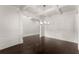 Dining room with dark hardwood floors, box ceilings and modern light fixture at 2855 Pilgrim Mill, Cumming, GA 30041