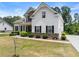 Beautiful two-story home with stone accents, lush landscaping, and an attached garage at 2855 Pilgrim Mill, Cumming, GA 30041