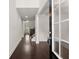 Inviting foyer with hardwood floors, wainscoting, and staircase leading to the second floor at 2855 Pilgrim Mill, Cumming, GA 30041
