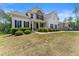 Charming two-story home with stone accents, manicured lawn and inviting front porch at 2855 Pilgrim Mill, Cumming, GA 30041