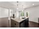 Modern kitchen island with granite countertops and stainless steel appliances in open concept living space at 2855 Pilgrim Mill, Cumming, GA 30041