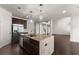 Kitchen island with granite countertops and stainless steel appliances at 2855 Pilgrim Mill, Cumming, GA 30041