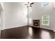 Bright living room with stone fireplace, dark wood floors, and high ceilings at 2855 Pilgrim Mill, Cumming, GA 30041