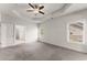 Bright main bedroom featuring neutral walls, ceiling fan, and carpet flooring at 2855 Pilgrim Mill, Cumming, GA 30041