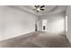 Large main bedroom showcases a ceiling fan, neutral walls, and carpet flooring at 2855 Pilgrim Mill, Cumming, GA 30041