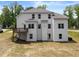 Exterior of home featuring back deck, double hung windows and a door to grade at 2855 Pilgrim Mill, Cumming, GA 30041