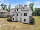Rear exterior of home featuring back deck, double hung windows, door to grade and central air unit at 2855 Pilgrim Mill, Cumming, GA 30041