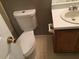 Bathroom with toilet and sink with vanity, featuring clean fixtures and neutral color scheme at 318 Bakers Bridge Cir, Douglasville, GA 30134