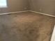 Neutral bedroom offering plush carpeting, ample natural light, and fresh paint at 318 Bakers Bridge Cir, Douglasville, GA 30134
