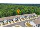 Aerial view of townhouses in a wooded area with street parking and driveways at 3481 Lakeview Crk, Lithonia, GA 30038