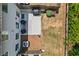 Aerial shot of a backyard featuring a patio set, grill, grass, and wooded area at 3481 Lakeview Crk, Lithonia, GA 30038