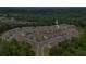 A community of townhouses nestled amongst the trees in an aerial view at 3481 Lakeview Crk, Lithonia, GA 30038