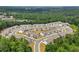 High angle aerial view of townhouses nestled among trees surrounded by winding roads at 3481 Lakeview Crk, Lithonia, GA 30038