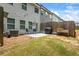 Exterior view of backyard featuring patio with furniture, grill, and grassy lawn at 3481 Lakeview Crk, Lithonia, GA 30038
