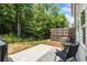 Cozy backyard with patio, seating, and privacy fence perfect for outdoor enjoyment at 3481 Lakeview Crk, Lithonia, GA 30038