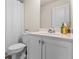 The bathroom features a single sink vanity, toilet, and shower with white fixtures and modern finishes at 3481 Lakeview Crk, Lithonia, GA 30038
