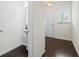 A powder room featuring a pedestal sink, mirror and tile flooring at 3481 Lakeview Crk, Lithonia, GA 30038